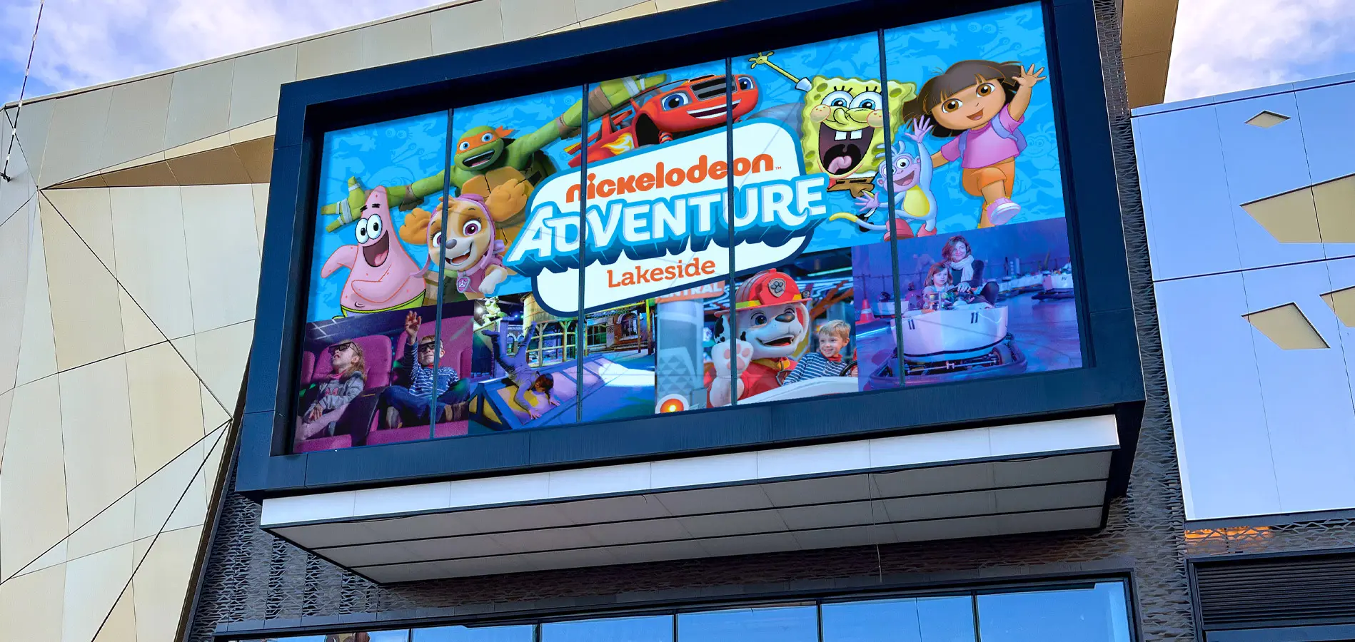 Shopping centre window displaying the advertising campaign design for nickelodeon adventure lakeside