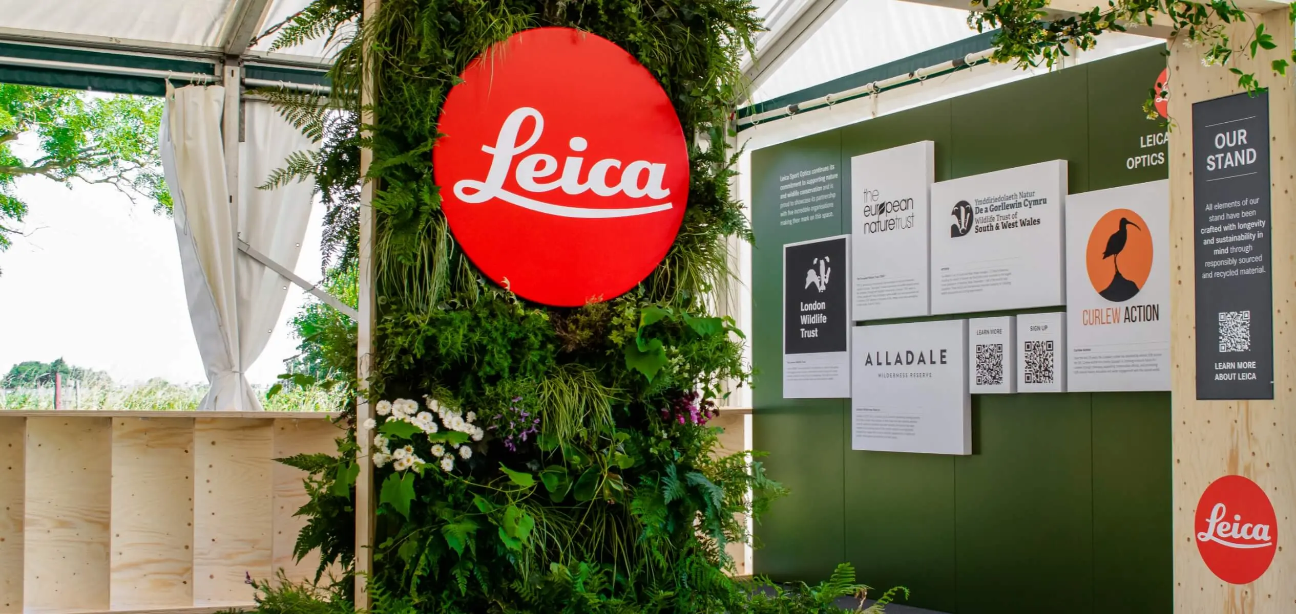Feature view of a living wall installation in a Leica exhibition stand, enhancing spatial design with greenery and organic visual impact.