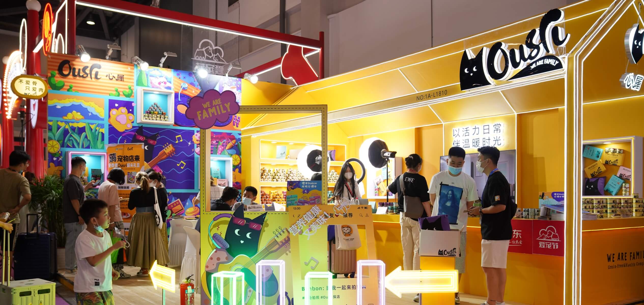 Wide view of Ousri bespoke exhibition stand showcasing large-scale graphic application and immersive brand storytelling.